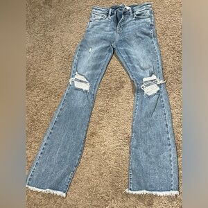 Hidden Distressed Flare Jeans with fringe